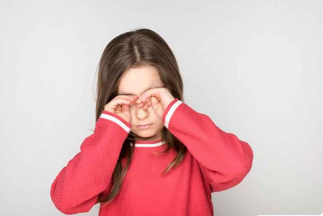 A kid suffering from eye blinking